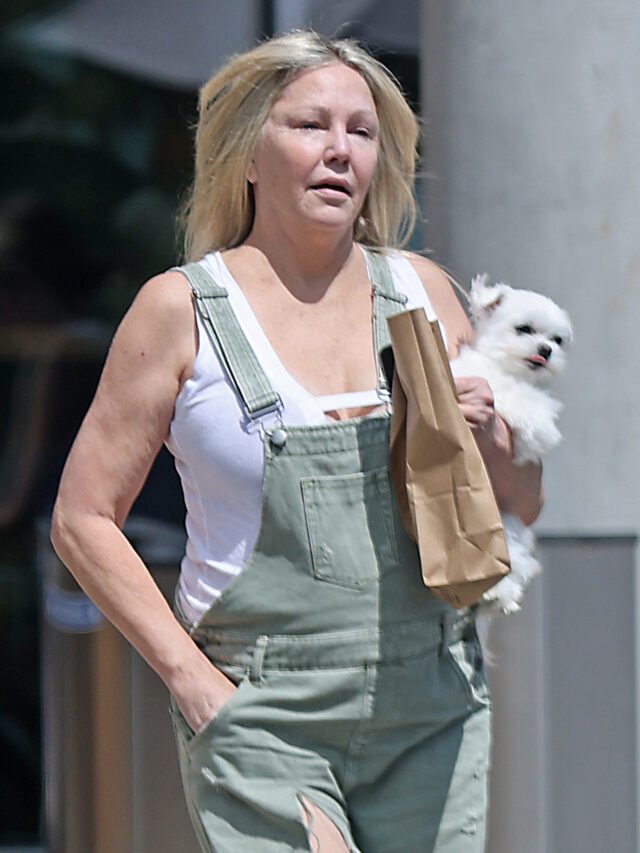 Heather Locklear appears to be talking to herself while balancing on a